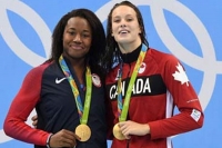 Simone manuel and penny oleksiak share olympic gold in rio