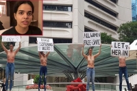 Women hold topless protest to support 18 year old rahaf