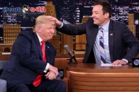 Jimmy fallon jokes with donald trump musses his hair