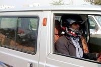 Indian traffic cops fine man for not wearing helmet while driving car