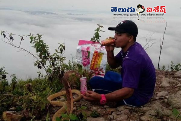Thai man living snake